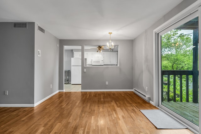 19 Harbour Vlg Unit B, Branford, CT 06405 - empty room featuring a baseboard heating unit, a chandelier, light wood-type flooring, and baseboards