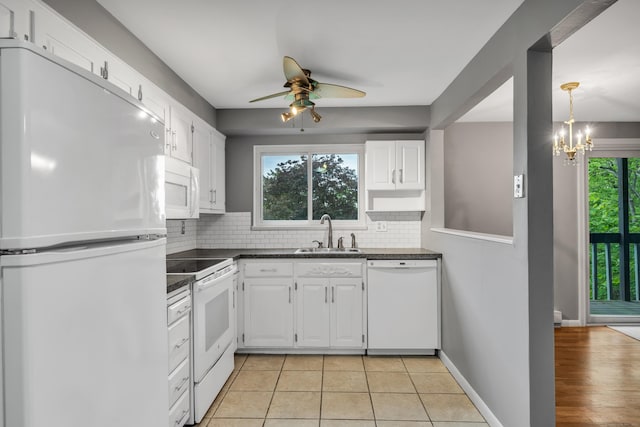 19 Harbour Vlg Unit B, Branford, CT 06405 - kitchen with white appliances, a sink, dark countertops, and decorative backsplash