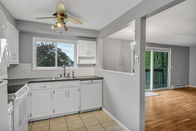 19 Harbour Vlg Unit B, Branford, CT 06405 - kitchen with white appliances, a sink, dark countertops, and white cabinetry