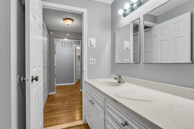 19 Harbour Vlg Unit B, Branford, CT 06405 - bathroom featuring vanity, wood finished floors, and baseboards
