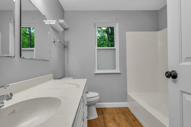 19 Harbour Vlg Unit B, Branford, CT 06405 - full bathroom featuring healthy amount of natural light, vanity, wood finished floors, and toilet