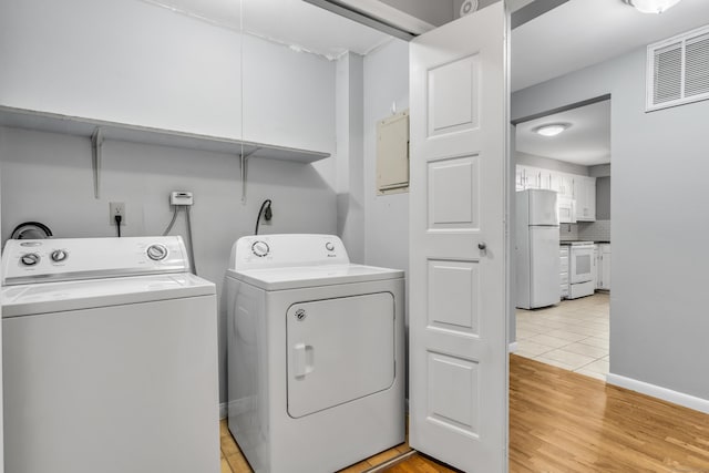19 Harbour Vlg Unit B, Branford, CT 06405 - washroom with washer and dryer and light wood-style floors