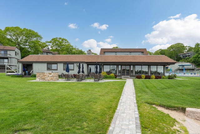 19 Harbour Vlg Unit B, Branford, CT 06405 - back of house with a patio area, a lawn, and a chimney