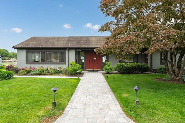 19 Harbour Vlg Unit B, Branford, CT 06405 - view of front of house featuring a front lawn and roof with shingles
