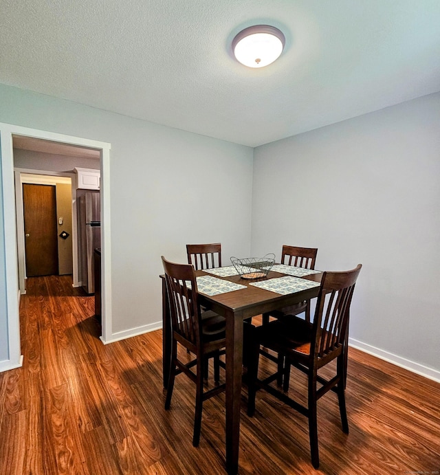 42 Village Rd Unit 42, Southington, CT 06489 - dining space with dark wood-style floors and baseboards