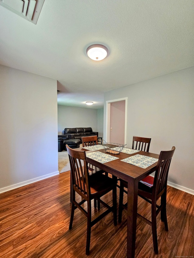 42 Village Rd Unit 42, Southington, CT 06489 - dining area with dark wood-type flooring and baseboards