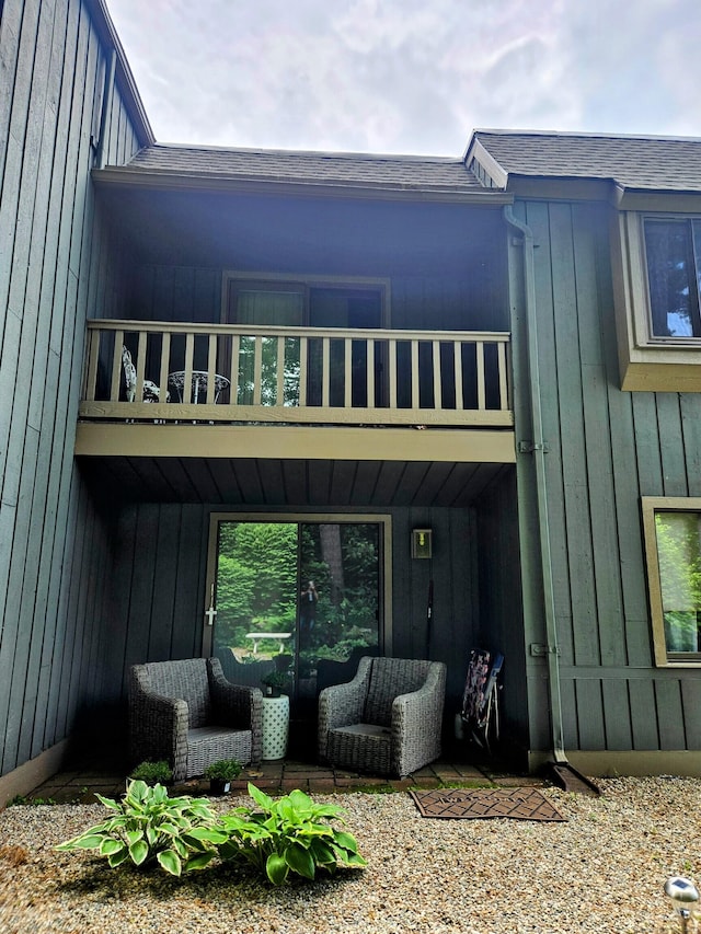 42 Village Rd Unit 42, Southington, CT 06489 - rear view of property featuring a balcony and a shingled roof