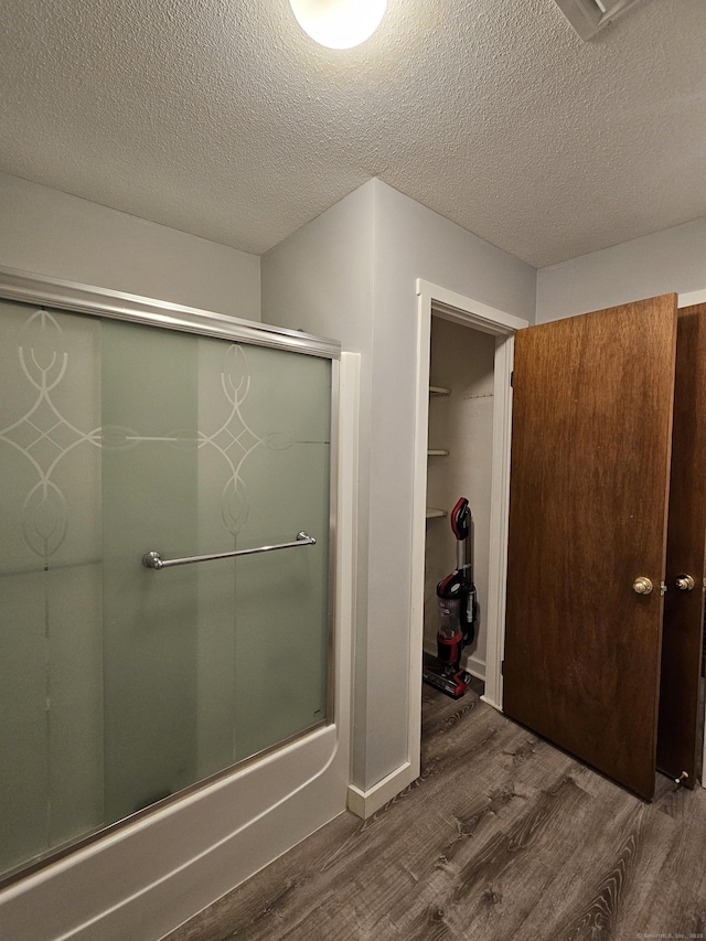 42 Village Rd Unit 42, Southington, CT 06489 - full bathroom with wood finished floors and a textured ceiling