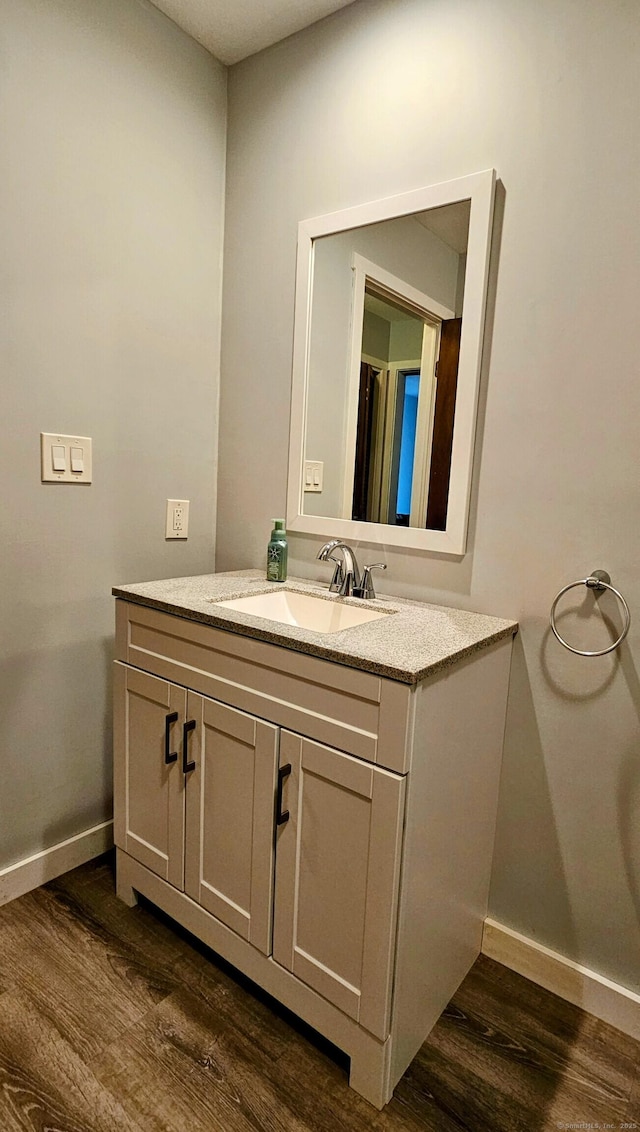 42 Village Rd Unit 42, Southington, CT 06489 - bathroom featuring wood finished floors, vanity, and baseboards