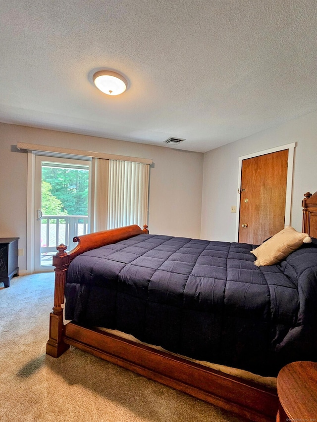 42 Village Rd Unit 42, Southington, CT 06489 - bedroom featuring carpet flooring, access to exterior, and a textured ceiling