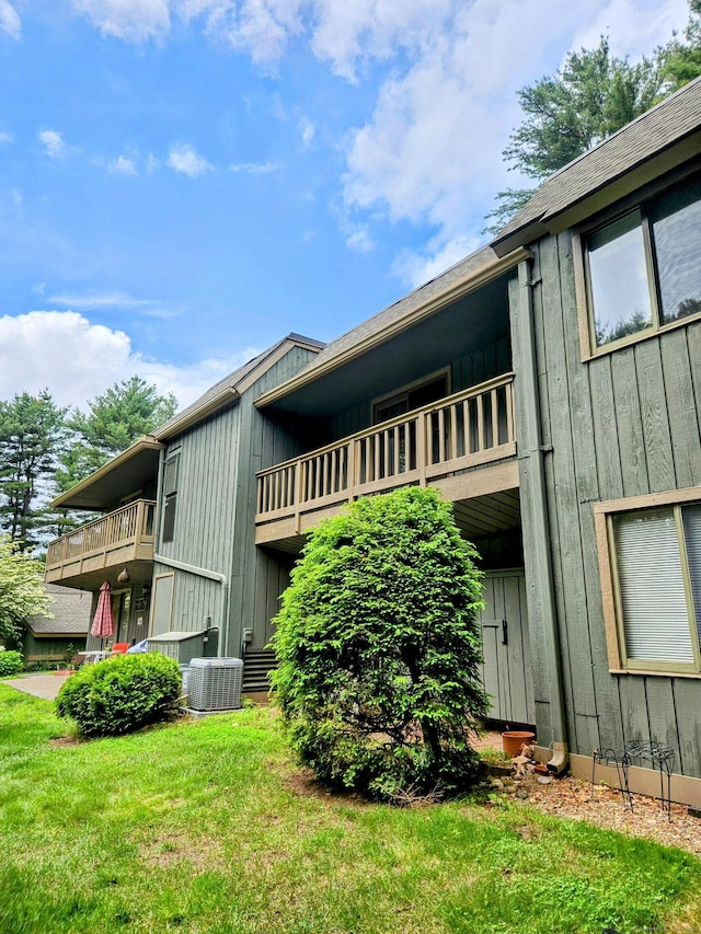 42 Village Rd Unit 42, Southington, CT 06489 - view of side of property featuring a balcony, central AC unit, and board and batten siding