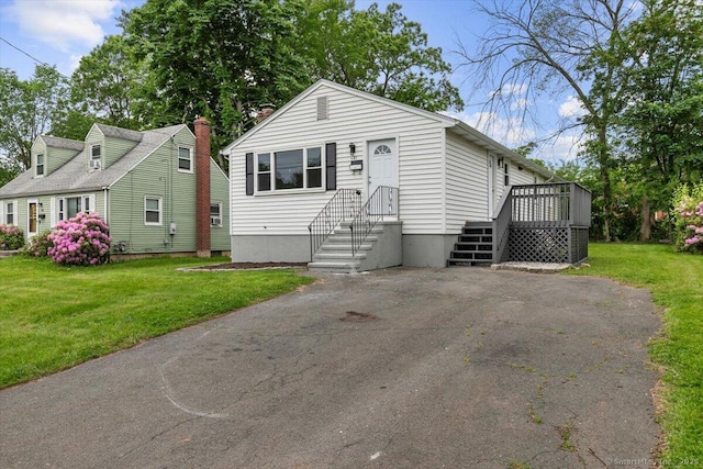 121 Lurton St, New Britain, CT 06053 - view of front of property with a front yard and a deck