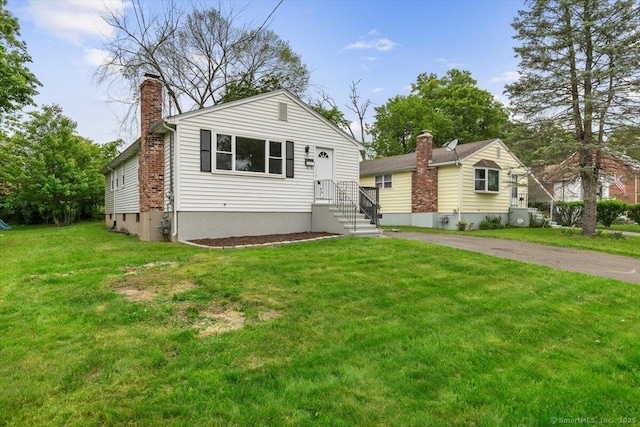 121 Lurton St, New Britain, CT 06053 - bungalow-style house with a chimney and a front yard