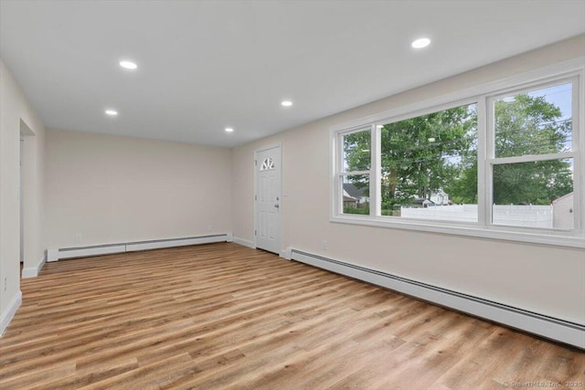 121 Lurton St, New Britain, CT 06053 - spare room featuring baseboard heating, a baseboard heating unit, wood finished floors, recessed lighting, and baseboards