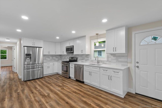 121 Lurton St, New Britain, CT 06053 - kitchen with stainless steel appliances, a sink, light countertops, white cabinetry, and recessed lighting