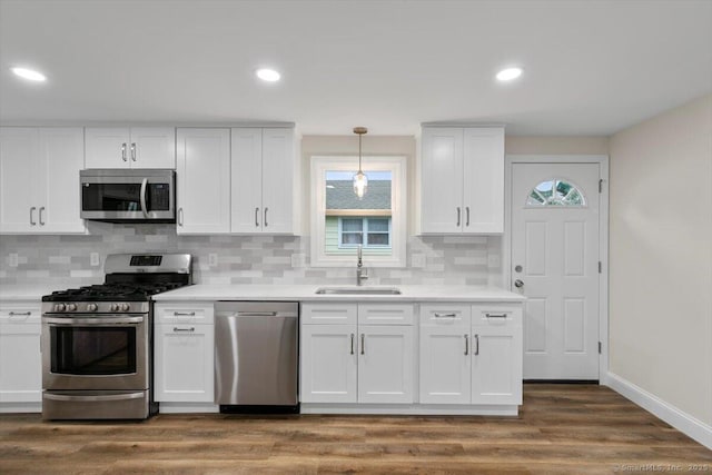 121 Lurton St, New Britain, CT 06053 - kitchen featuring stainless steel appliances, a sink, healthy amount of natural light, white cabinets, and recessed lighting