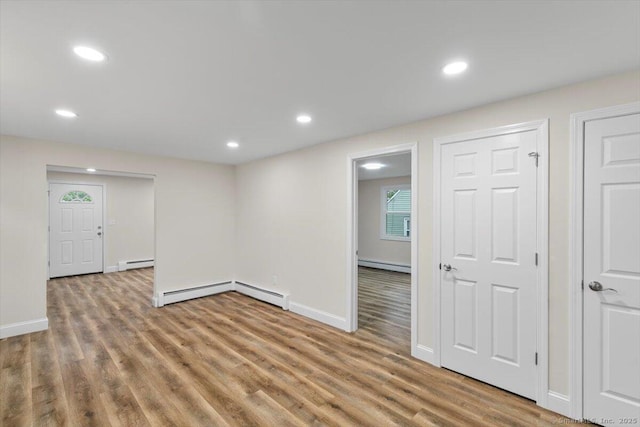 121 Lurton St, New Britain, CT 06053 - unfurnished room with a baseboard radiator, wood finished floors, recessed lighting, and baseboards