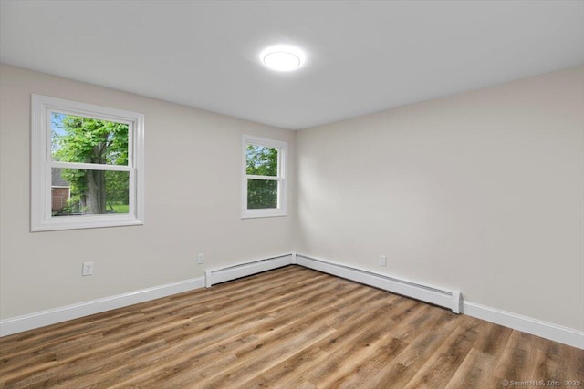 121 Lurton St, New Britain, CT 06053 - unfurnished room featuring wood finished floors, baseboards, and baseboard heating