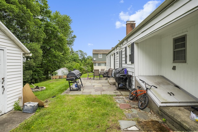 327 Steele St, New Britain, CT 06052 - view of green lawn featuring a patio area