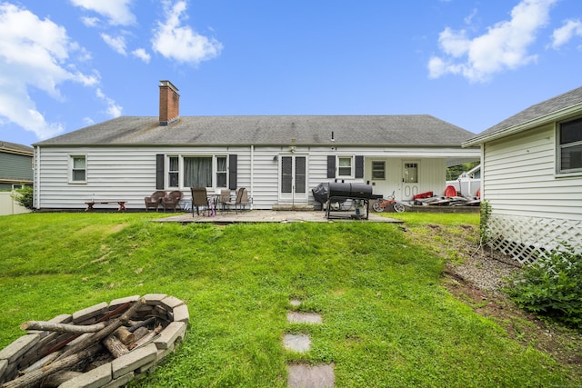 327 Steele St, New Britain, CT 06052 - rear view of property with an outdoor fire pit, a chimney, a yard, and a patio