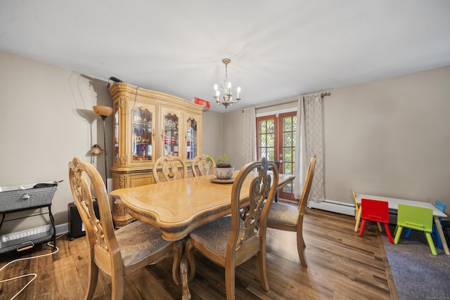 327 Steele St, New Britain, CT 06052 - dining area with a chandelier, wood finished floors, french doors, and a baseboard heating unit