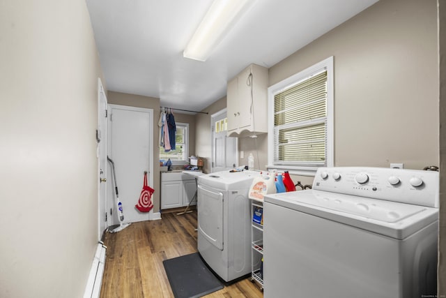 327 Steele St, New Britain, CT 06052 - laundry room with cabinet space, separate washer and dryer, light wood-type flooring, and plenty of natural light
