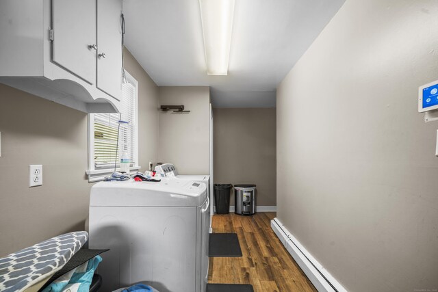327 Steele St, New Britain, CT 06052 - laundry area featuring baseboard heating, dark wood-style flooring, washing machine and clothes dryer, and baseboards