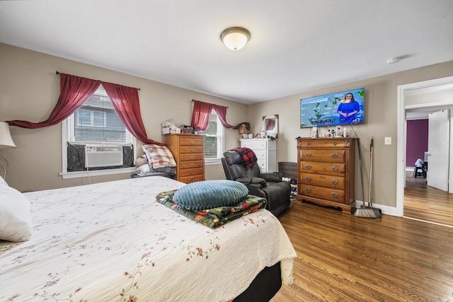 327 Steele St, New Britain, CT 06052 - bedroom with wood finished floors, cooling unit, multiple windows, and baseboards