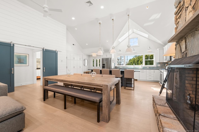 27 Quarry Rd, Stonington, CT 06355 - dining area featuring high vaulted ceiling, light wood-style flooring, ceiling fan, and recessed lighting