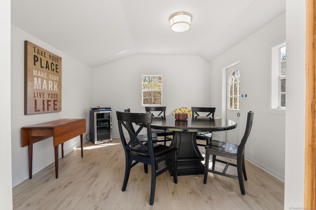 27 Quarry Rd, Stonington, CT 06355 - dining space with light wood-style flooring, baseboards, and vaulted ceiling