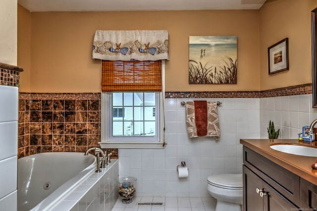 19 Old Colony Rd Unit 19, Monroe, CT 06468 - bathroom featuring tile walls, vanity, a jetted tub, toilet, and tile patterned flooring
