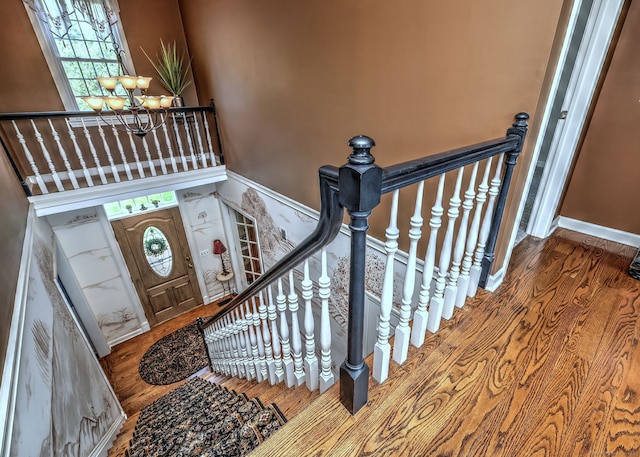 19 Old Colony Rd Unit 19, Monroe, CT 06468 - stairs featuring a chandelier, wood finished floors, and plenty of natural light