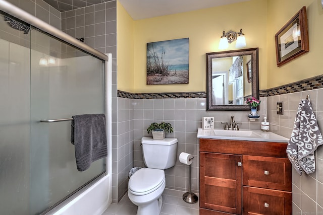 19 Old Colony Rd Unit 19, Monroe, CT 06468 - bathroom with tile walls, vanity, toilet, combined bath / shower with glass door, and wainscoting