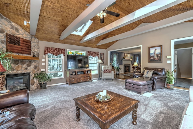 19 Old Colony Rd Unit 19, Monroe, CT 06468 - carpeted living area with a stone fireplace, wood ceiling, a skylight, a ceiling fan, and baseboards