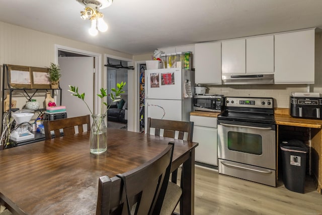24 Rocky Hill Ave, New Britain, CT 06051 - kitchen with stainless steel appliances, under cabinet range hood, white cabinetry, light wood-type flooring, and decorative backsplash