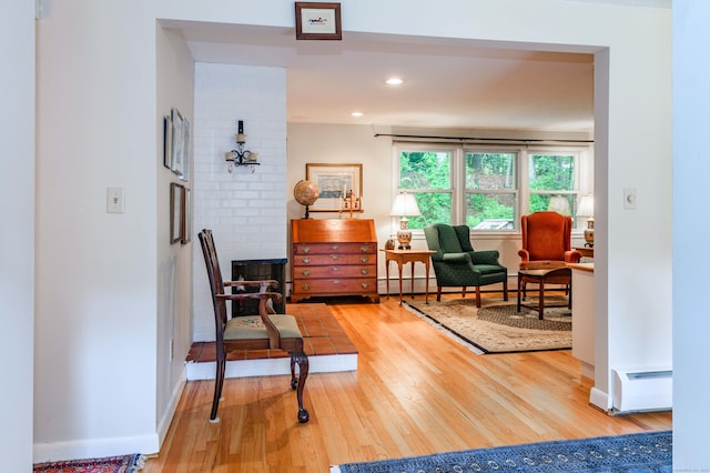 20 Wescott Rd, Simsbury, CT 06070 - living area with wood finished floors, baseboard heating, recessed lighting, and baseboards