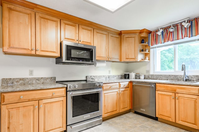 20 Wescott Rd, Simsbury, CT 06070 - kitchen with stainless steel appliances, a sink, light stone counters, and open shelves