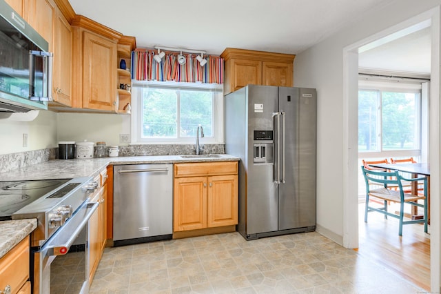 20 Wescott Rd, Simsbury, CT 06070 - kitchen featuring premium appliances, a sink, plenty of natural light, and light stone counters