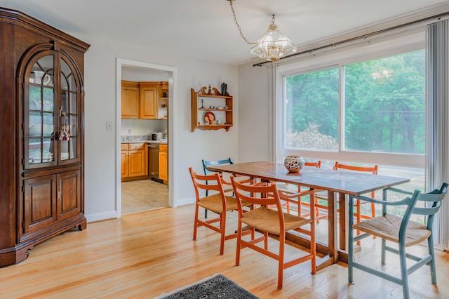 20 Wescott Rd, Simsbury, CT 06070 - dining space featuring a chandelier, light wood-type flooring, and baseboards