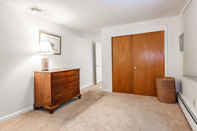 20 Wescott Rd, Simsbury, CT 06070 - bedroom featuring a baseboard radiator, a closet, baseboards, and light carpet