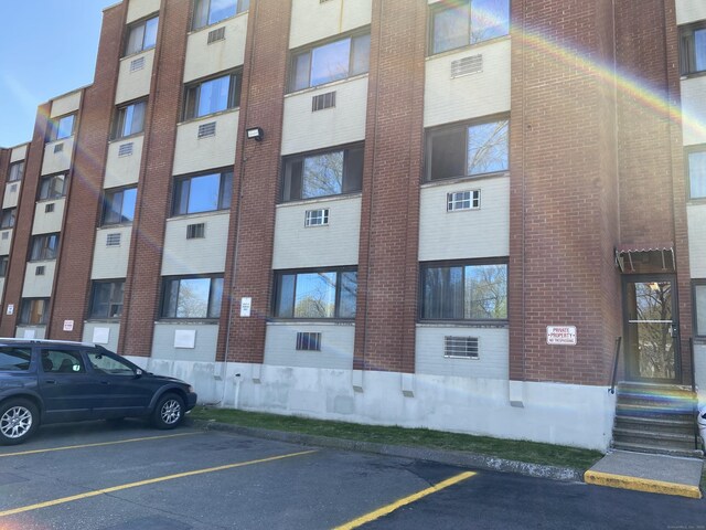 1700 Broadbridge Ave Unit A16, Stratford, CT 06614 - view of apartment building / complex with uncovered parking