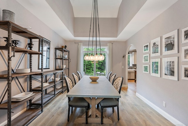 86 Charolais Way, Burlington, CT 06013 - dining space with arched walkways, light wood-style flooring, and baseboards