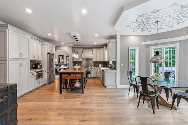 86 Charolais Way, Burlington, CT 06013 - kitchen featuring stainless steel appliances, premium range hood, recessed lighting, decorative backsplash, and light countertops