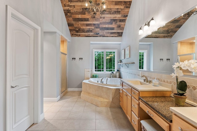 86 Charolais Way, Burlington, CT 06013 - bathroom with a bath, a shower stall, tile patterned flooring, wooden ceiling, and a chandelier