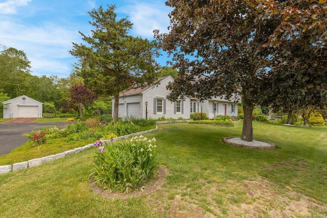 36 Holly Ln, Middletown, CT 06457 - view of property hidden behind natural elements featuring a detached garage and a front yard