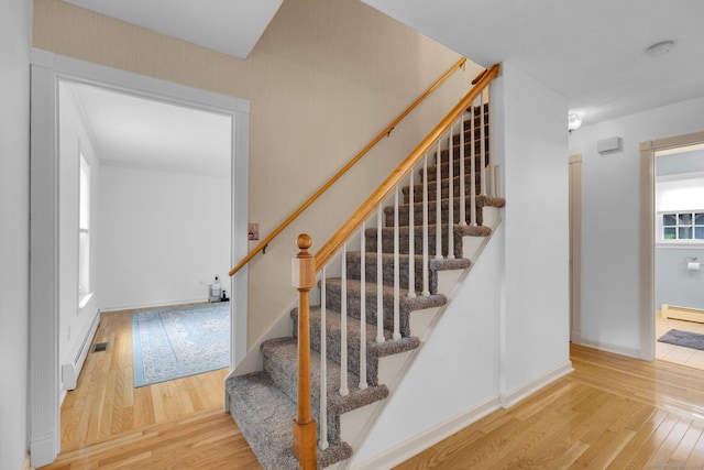 36 Holly Ln, Middletown, CT 06457 - staircase featuring wood finished floors and baseboard heating