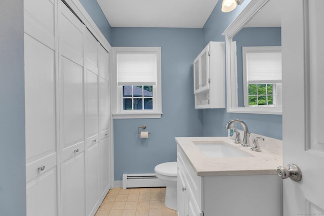 36 Holly Ln, Middletown, CT 06457 - bathroom with a baseboard radiator, vanity, tile patterned flooring, and a closet