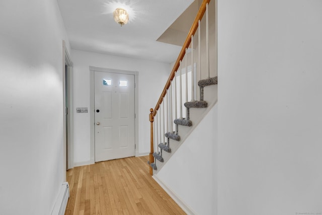 36 Holly Ln, Middletown, CT 06457 - foyer featuring light wood finished floors, stairway, and baseboard heating