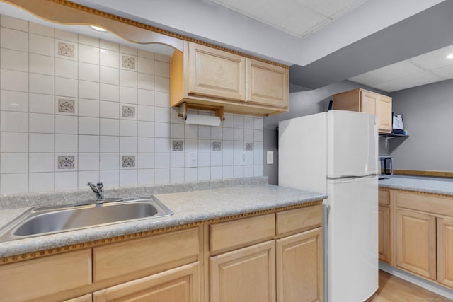 36 Holly Ln, Middletown, CT 06457 - kitchen featuring light brown cabinetry, freestanding refrigerator, light countertops, and decorative backsplash