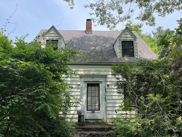 63 Park Rd, Hamden, CT 06517 - cape cod-style house with a chimney and a shingled roof